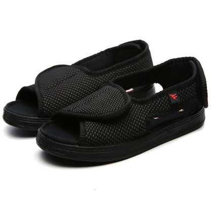 Pair of Harper’s Haven black adaptive sandals with open toes and fully adjustable Velcro fastenings