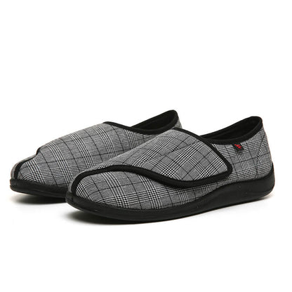 Arthur's Accolade unisex adaptive slippers laid flat showing grid 
pattern upper and wide touch-fastening closure for swollen feet NZ