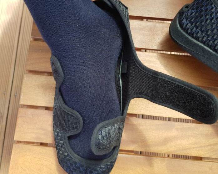 Eleanor's Essence adaptive slipper worn on feet shown fully open and flat, adjustable design for swollen feet and ankles up to 33cm circumference NZ