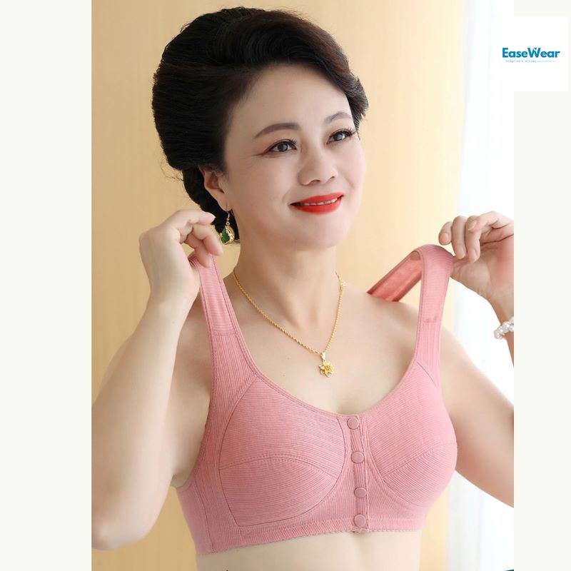 Senior woman wearing pink front opening adaptive bra with button closure NZ