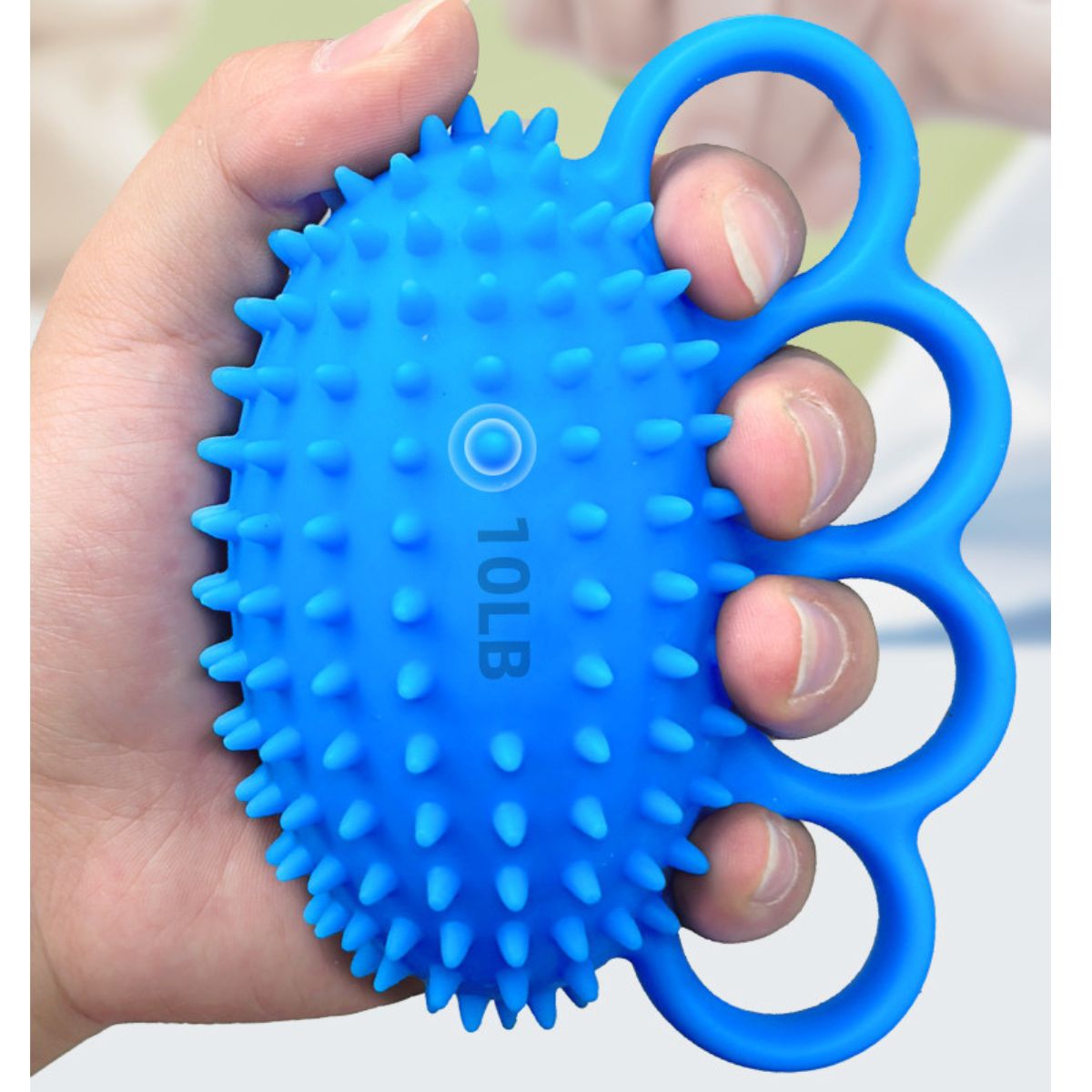 Close-up of hand gripping blue 10lb hand exerciser ball with finger loops NZ
