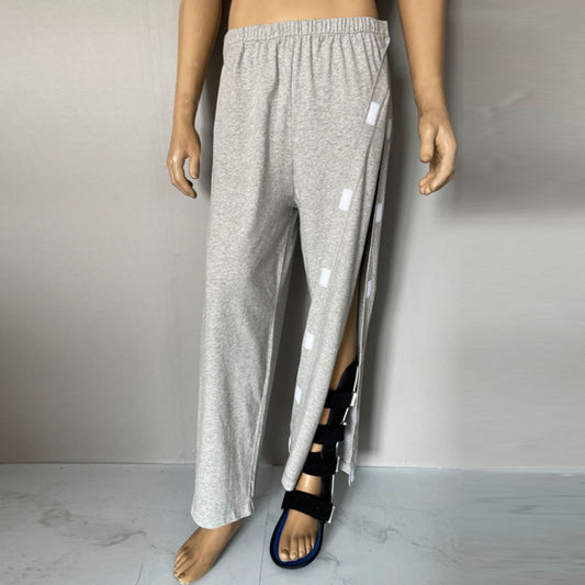 Grey adaptive pants for men with a comfortable elastic waistband, Velcro closure, shown on a standing mannequin