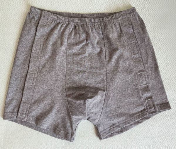 Men's adaptive side-opening boxer shorts laid flat showing front 
view, looks like regular underwear with discreet Velcro side openings for easy dressing with limited mobility NZ