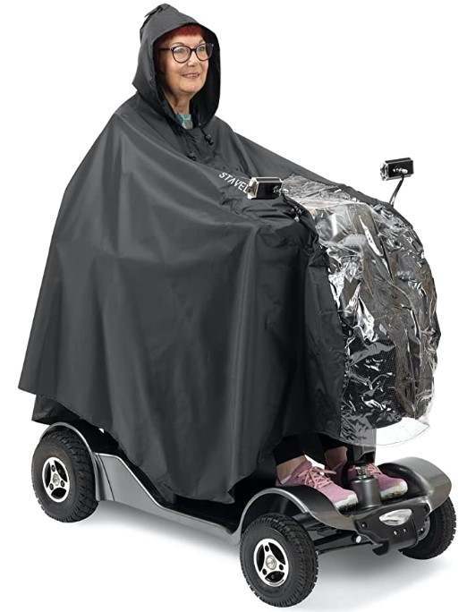 Mobility Scooter Rain Poncho worn on a scooter, showing full coverage over the rider and tiller