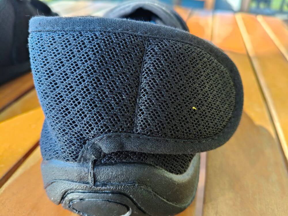 Noah's Breeze adaptive shoe close-up showing breathable mesh upper and wide Velcro strap open at the heel, easy wide-entry fastening for swollen feet and limited dexterity NZ