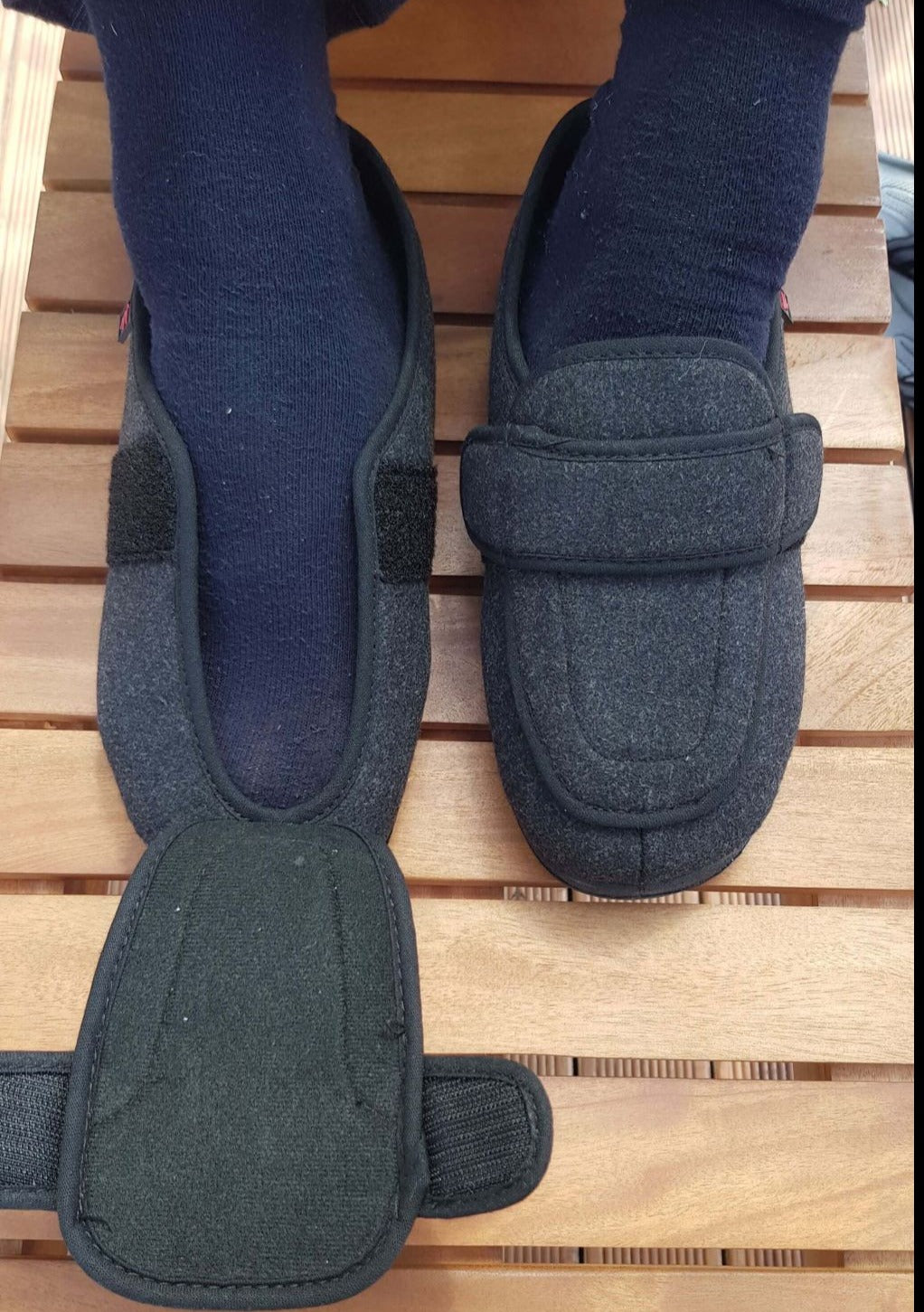 Owen's Oasis unisex adjustable wool blend slippers in black worn on foot, extra wide fit with adjustable strap for swollen feet NZ