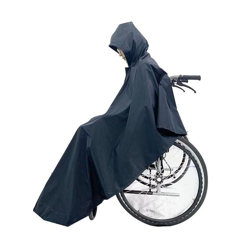 Wheelchair Rain Poncho worn while being pushed, showing side coverage over the wheel
