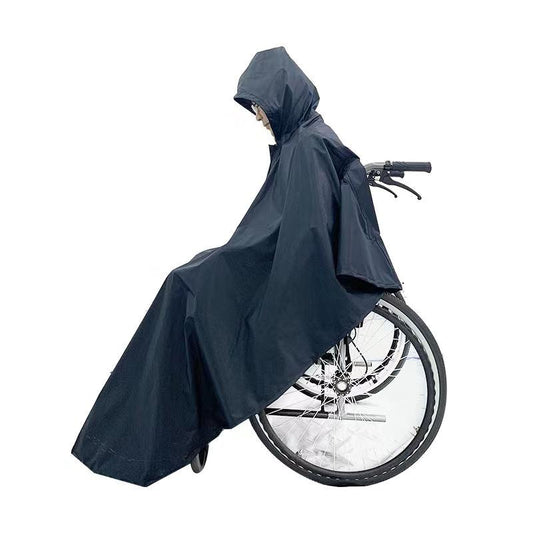 Wheelchair Rain Poncho worn while being pushed, showing side coverage over the wheel