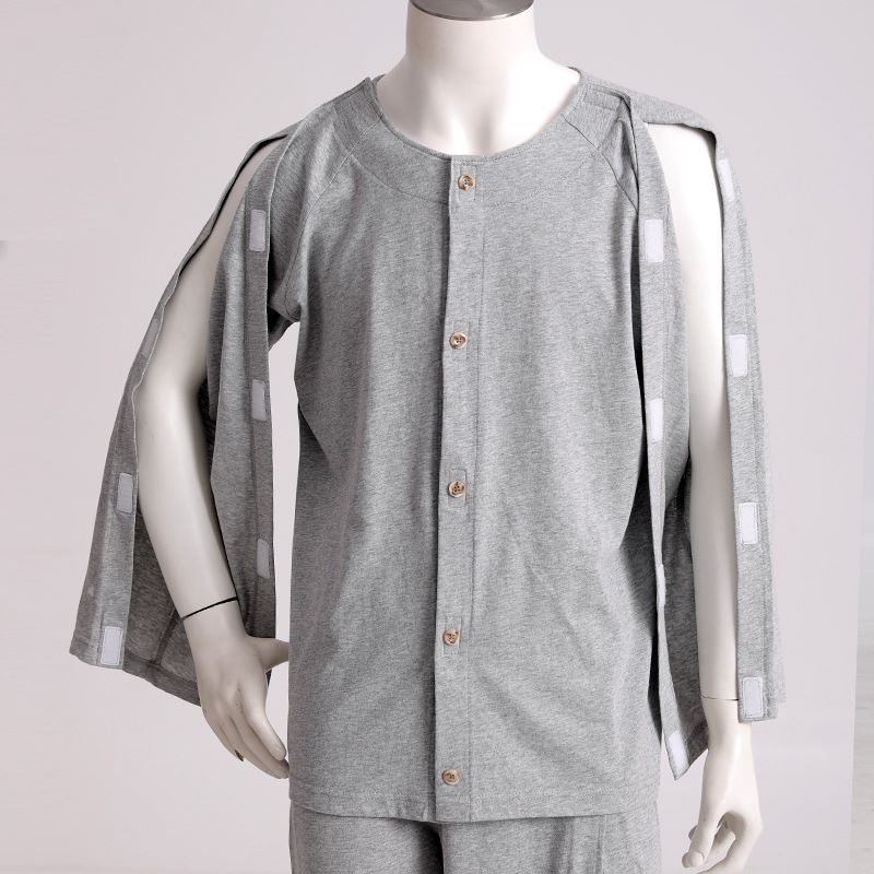 Men’s grey adaptive long sleeve top with full shoulder and sleeve Velcro openings shown open on a mannequin.