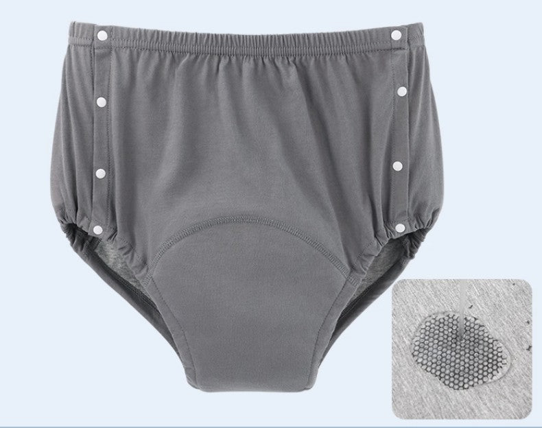 Two-sided Velcro opening incontinence briefs shown open flat,  both side Velcro fastenings visible for carer-assisted or lying-down dressing NZ
