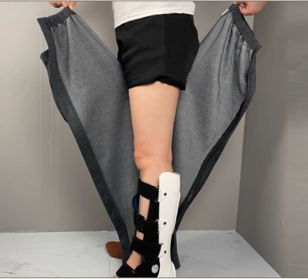 Unisex tear-away pants shown fully opened along the side