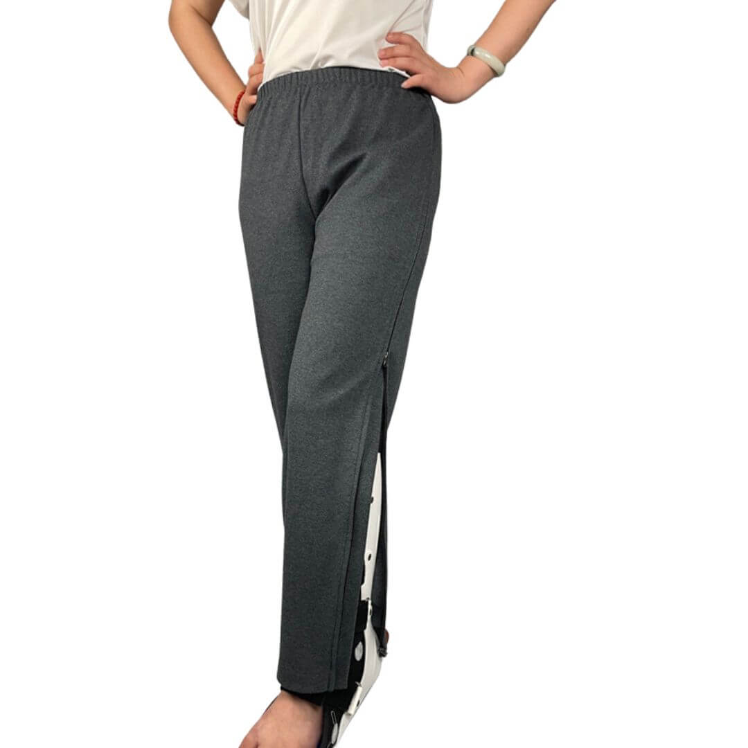 Women's adaptive pants worn with the zip side opening partially open