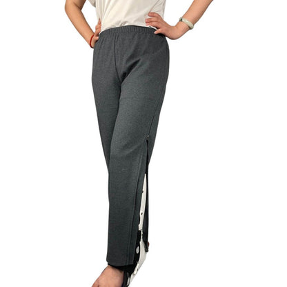 Women's adaptive pants worn with the zip side opening partially open